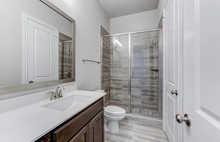 Representative furnished interior of a home built from the 3798 by Ravenna Homes in The Woodlands Hills 65′, Willis (Image 27).
