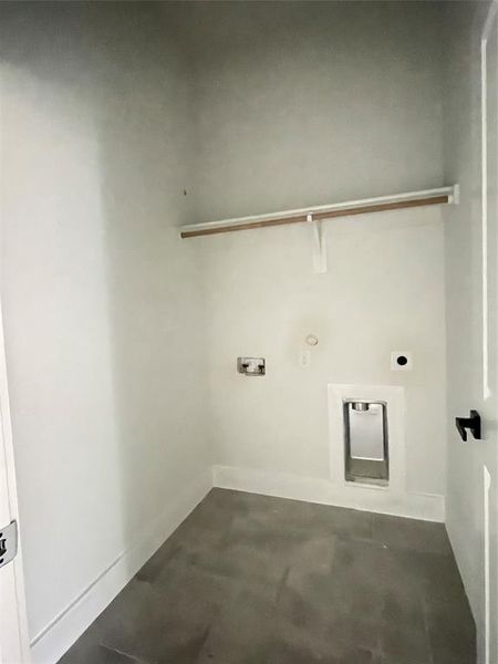 Clothes washing area with electric dryer hookup and washer hookup