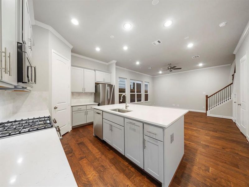 Open and bright, the kitchen opens up to the living and dining areas. (Sample photo of a completed Sterling Floor Plan. Image may show alternative features/and or upgrades.)