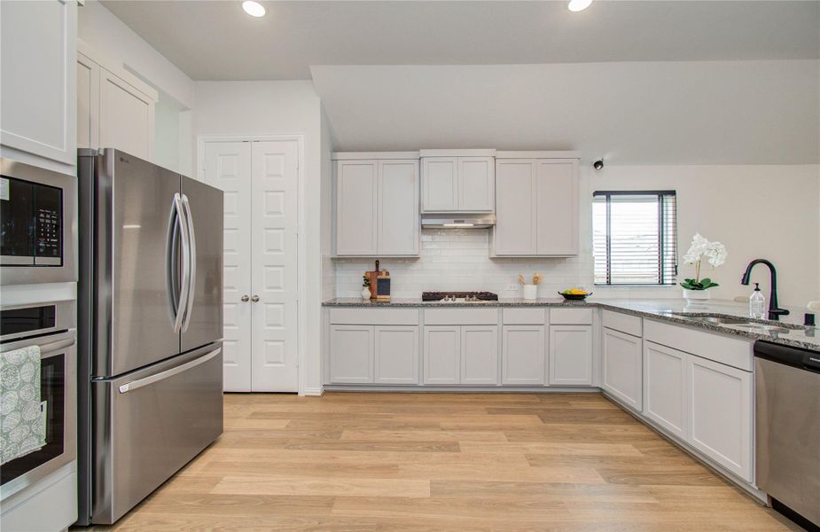 Furnished interior view inside a new home in Sunterra, Katy (Image 13).