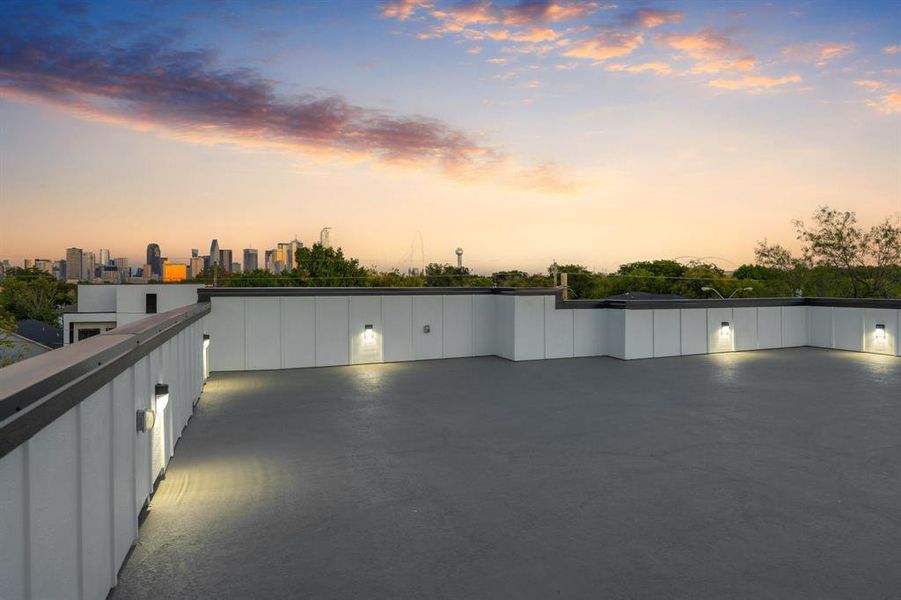 View of rooftop patio featuring a skyline view View of rooftop patio featuring a skyline view