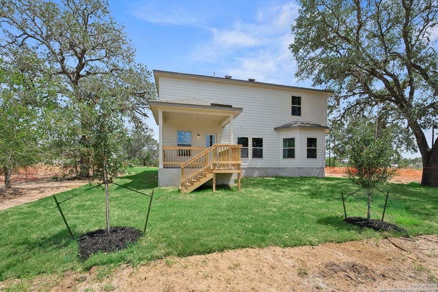 Front exterior of a new home in Jordan's Ranch, San Antonio, TX, highlighting curb appeal (Image 15). Front exterior of a new home in Jordan's Ranch, San Antonio, TX, highlighting curb appeal (Image 15).