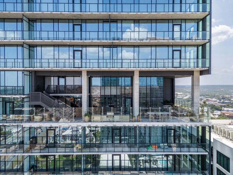Spacious balconies define this modern high-rise.