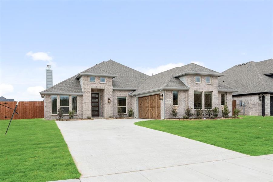 Front exterior of a new home in Ridgepoint, Midlothian, TX, highlighting curb appeal (Image 21).