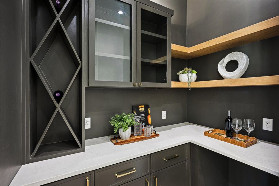 A little unexpected and a lot of fun, this custom wine grotto brings instant personality with dedicated bottle and stemware storage, space for a beverage chiller, extra outlets for cocktail prep and the flexibility to double as a stylish coffee bar.