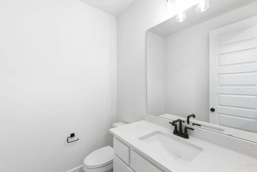 Furnished interior view inside a new home in The Colony, Bastrop (Image 9).