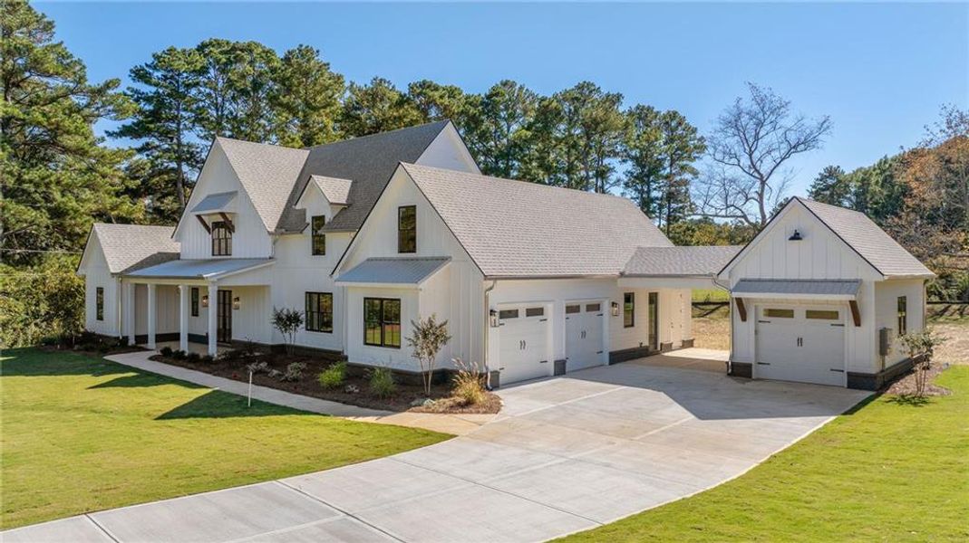 Front exterior of a new home in , Woodstock, GA, highlighting curb appeal (Image 31).