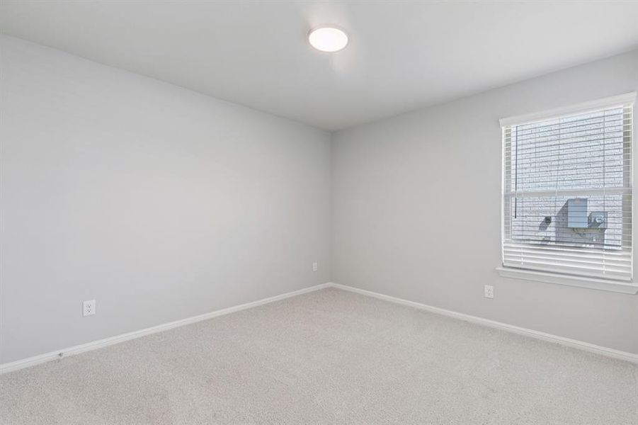 Bedroom in the Harrison home plan by Trophy Signature Homes – REPRESENTATIVE PHOTO Bedroom in the Harrison home plan by Trophy Signature Homes – REPRESENTATIVE PHOTO