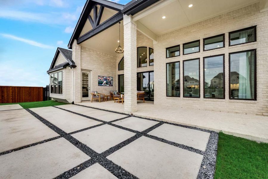 Exterior details and patio area of a home in Lakes at Legacy, Prosper (Image 2). Exterior details and patio area of a home in Lakes at Legacy, Prosper (Image 2).
