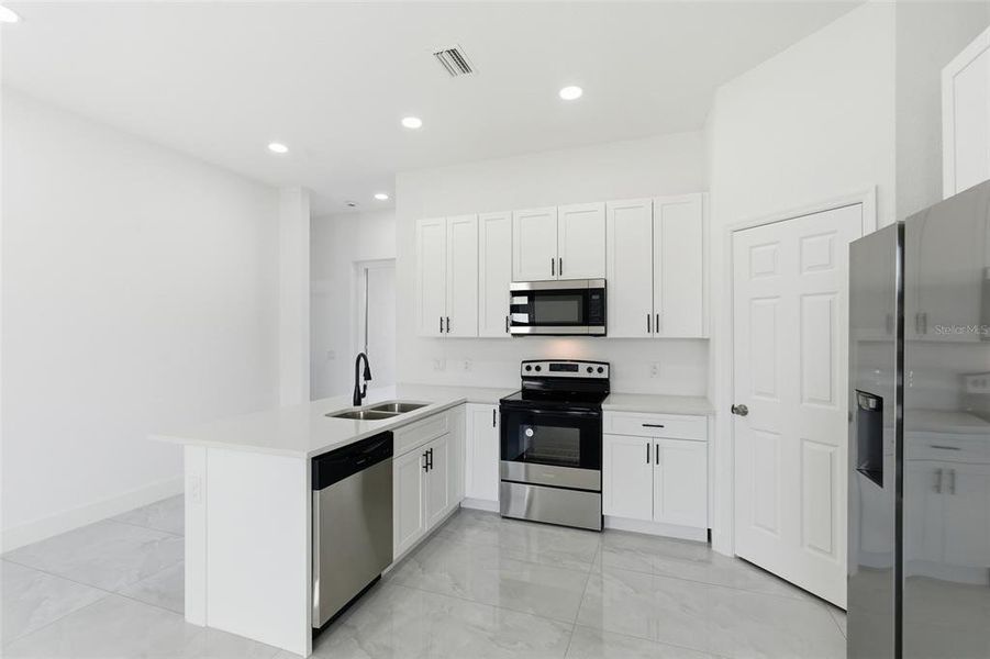 Furnished interior view inside a new home in , Port Charlotte (Image 7).