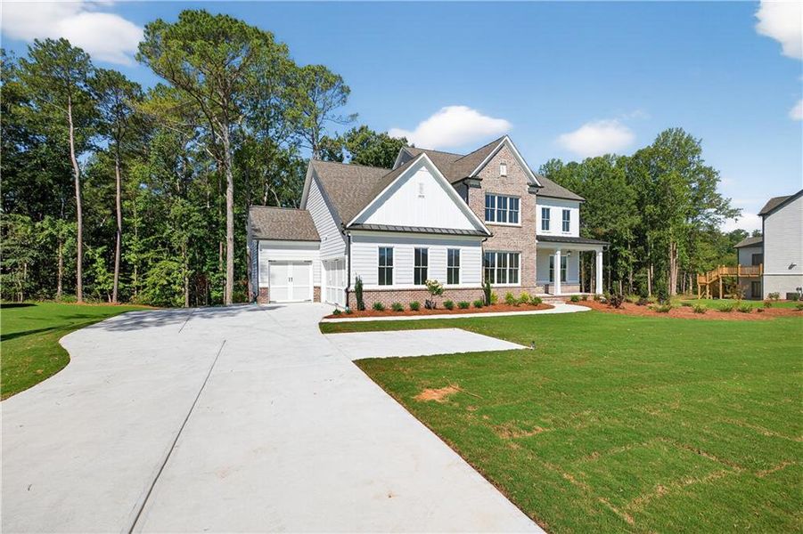 Front exterior of a new home in , Cumming, GA, highlighting curb appeal (Image 39).