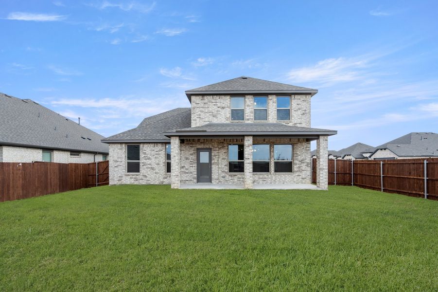 Front exterior of a new home in Timberbrook, Justin, TX, highlighting curb appeal (Image 28). Front exterior of a new home in Timberbrook, Justin, TX, highlighting curb appeal (Image 28).