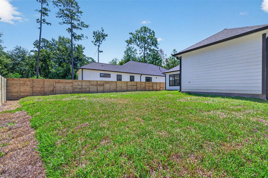Exterior details and patio area of a home in , Conroe (Image 30).