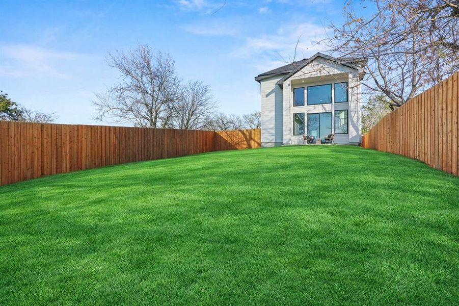 View of fenced backyard