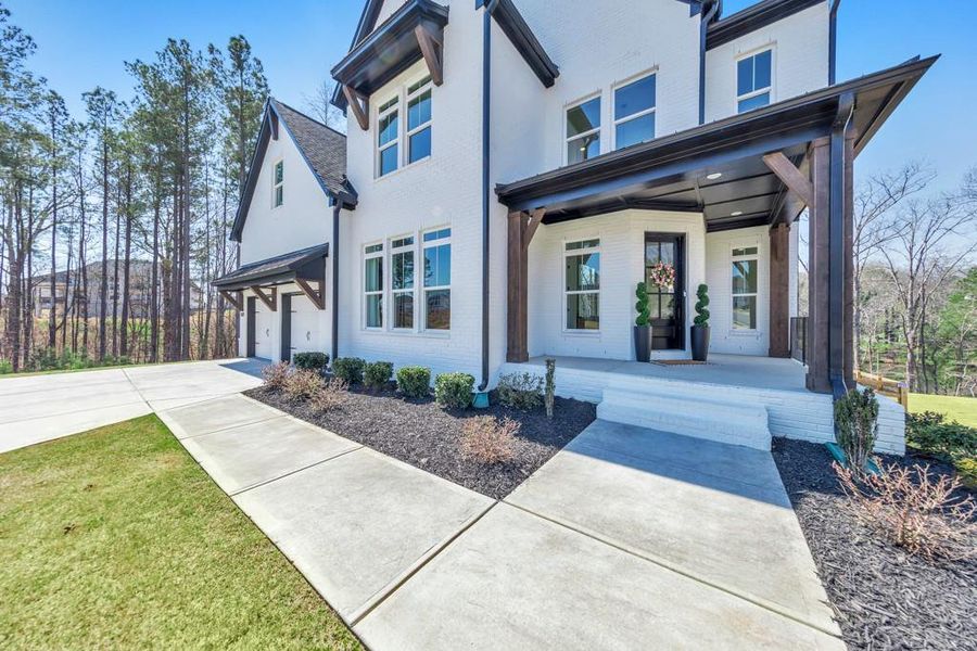 Front exterior of a new home in , Woodstock, GA, highlighting curb appeal (Image 28).