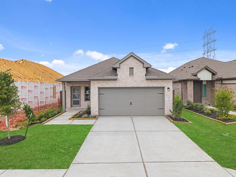 Front exterior of a new home in Creekhaven, Rosharon, TX, highlighting curb appeal (Image 19).