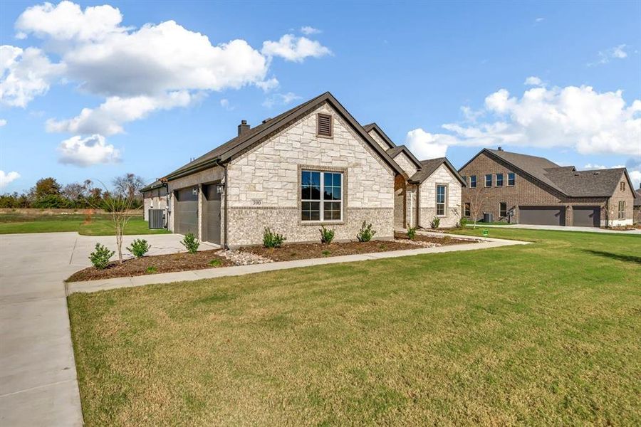 Front exterior of a new home in Fannin Ranch, Leonard, TX, highlighting curb appeal (Image 21). Front exterior of a new home in Fannin Ranch, Leonard, TX, highlighting curb appeal (Image 21).