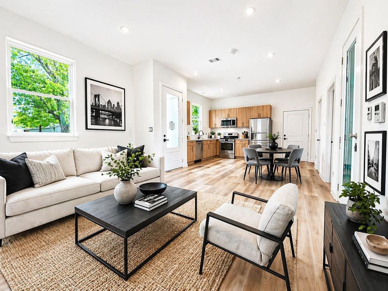 First floor living and dining.   Virtual staging added.