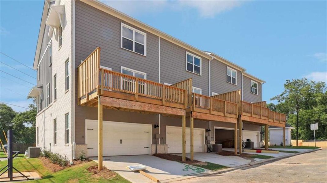 Exterior details and patio area of a home in Townes at Asbury, Hapeville (Image 24).