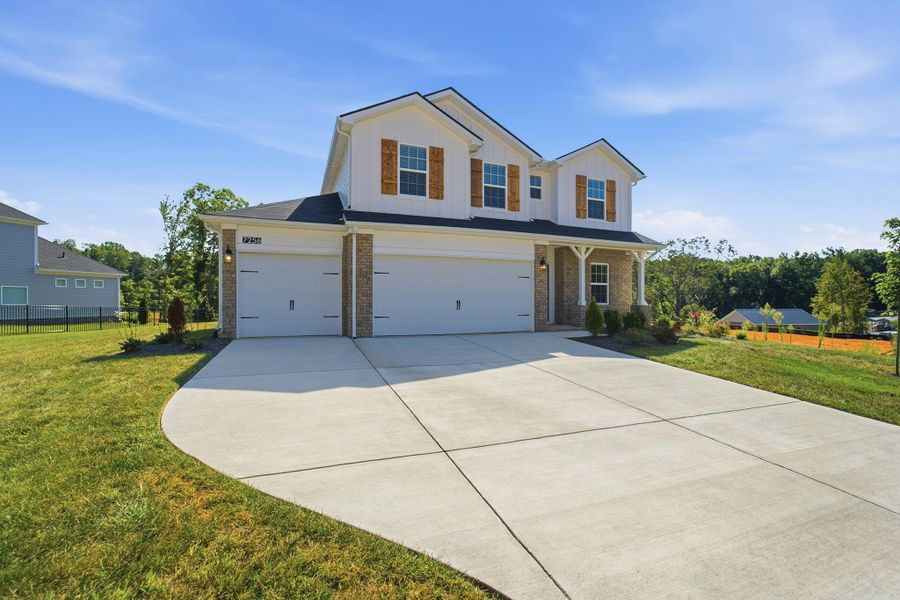 Front exterior of a new home in Brush Creek, Fairview, TN, highlighting curb appeal (Image 2). Front exterior of a new home in Brush Creek, Fairview, TN, highlighting curb appeal (Image 2).