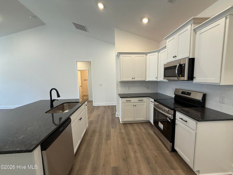 Furnished interior view inside a new home in Wood Creek Landing, Leland (Image 8).