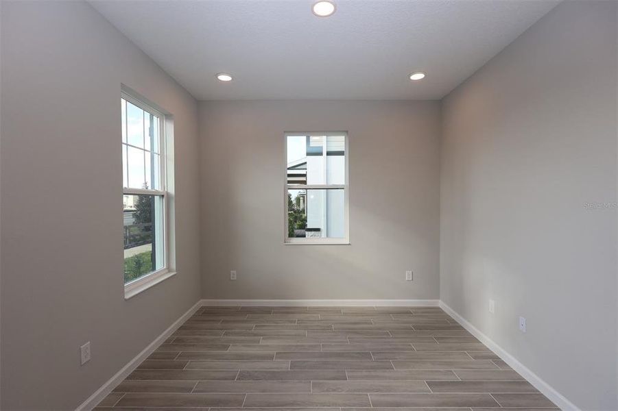 Spacious, unfurnished interior of a new home in Tribute at Ovation, Winter Garden (Image 32).