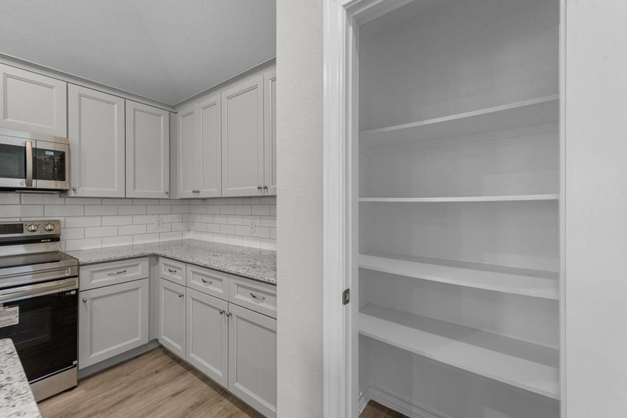 Furnished interior view inside a new home in The Enclave at Spring Branch, Conroe (Image 12).