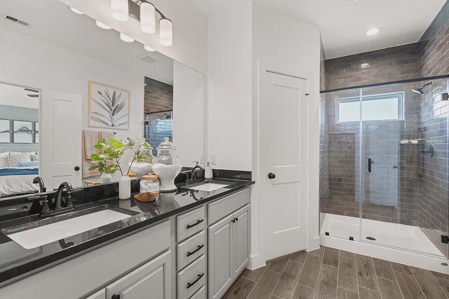 Representative furnished interior of a home built from the Countryside by Chesmar Homes in Meridiana Townhomes, Iowa Colony (Image 24).