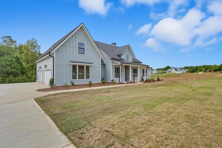 Front exterior of a new home in Old Town Estates, Monroe, GA, highlighting curb appeal (Image 21).