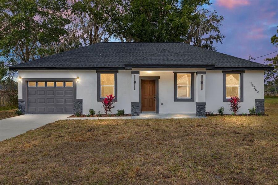 Front exterior of a new home in , Summerfield, FL, highlighting curb appeal (Image 2).