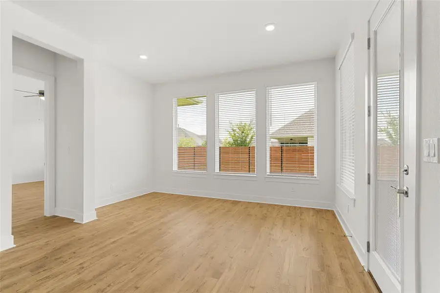 Laminated flooring and natural light define this open-plan living space. Laminated flooring and natural light define this open-plan living space.