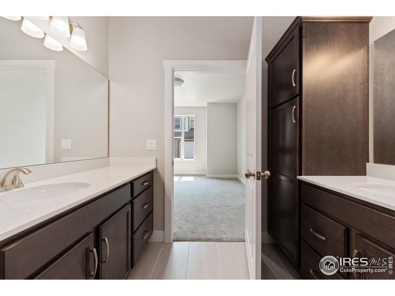 Primary bath with extra storage & two separate vanities. Primary bath with extra storage & two separate vanities.