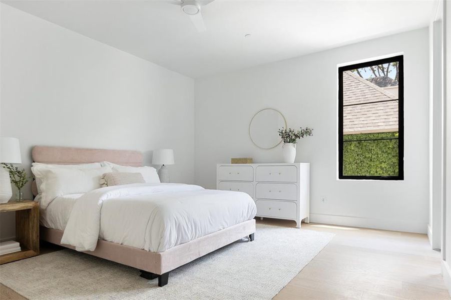 Bedroom featuring light hardwood / wood-style flooring and ceiling fan