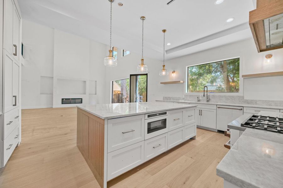 A true culinary masterpiece the chef’s kitchen features a massive quartzite island