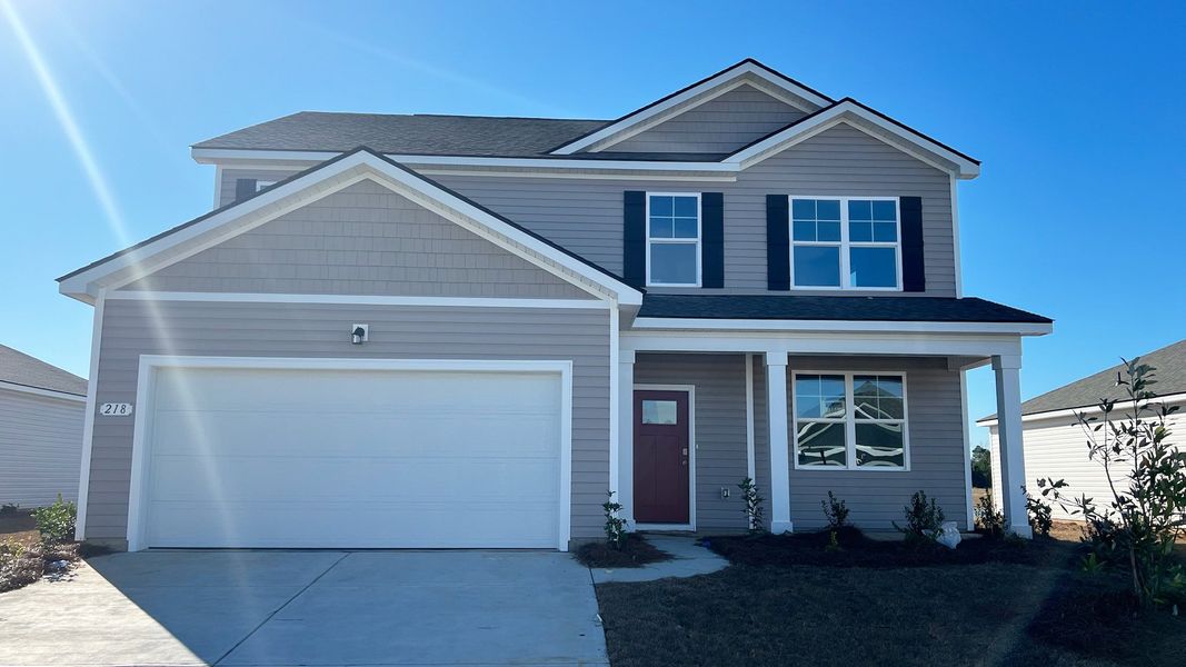 Representative exterior photo of a completed home built from the ELLE by D.R. Horton in Ravenloft, Conway, SC (Image 14).