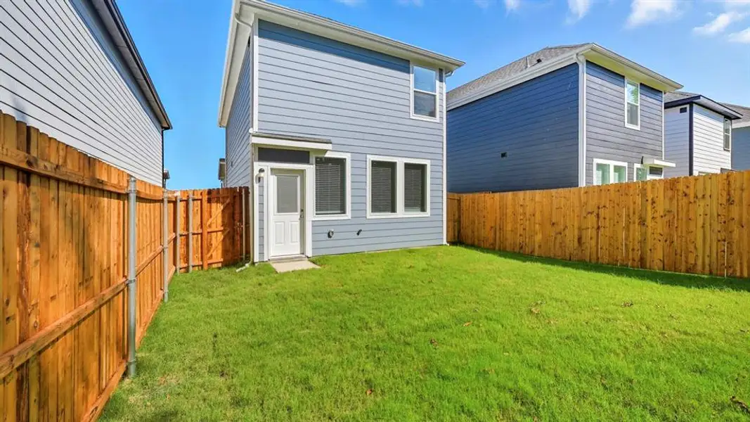 Back of property featuring a fenced backyard Back of property featuring a fenced backyard