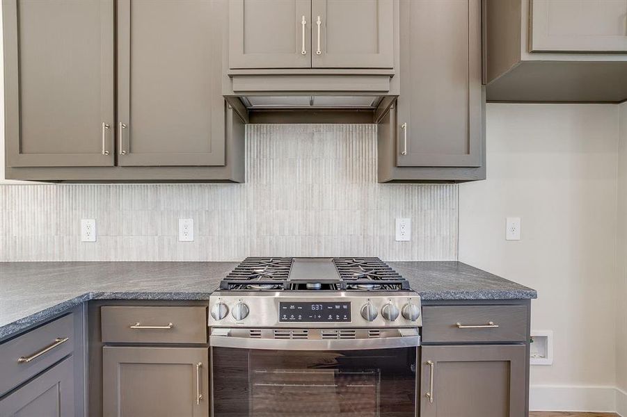 A kitchen that inspires your inner chef with GE stainless steel appliances and gas range. A kitchen that inspires your inner chef with GE stainless steel appliances and gas range.
