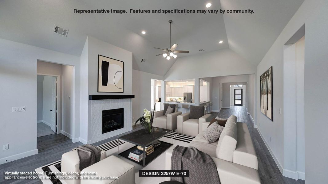 Living area featuring dark wood-style flooring, a fireplace, a ceiling fan, recessed lighting, and high vaulted ceiling Living area featuring dark wood-style flooring, a fireplace, a ceiling fan, recessed lighting, and high vaulted ceiling