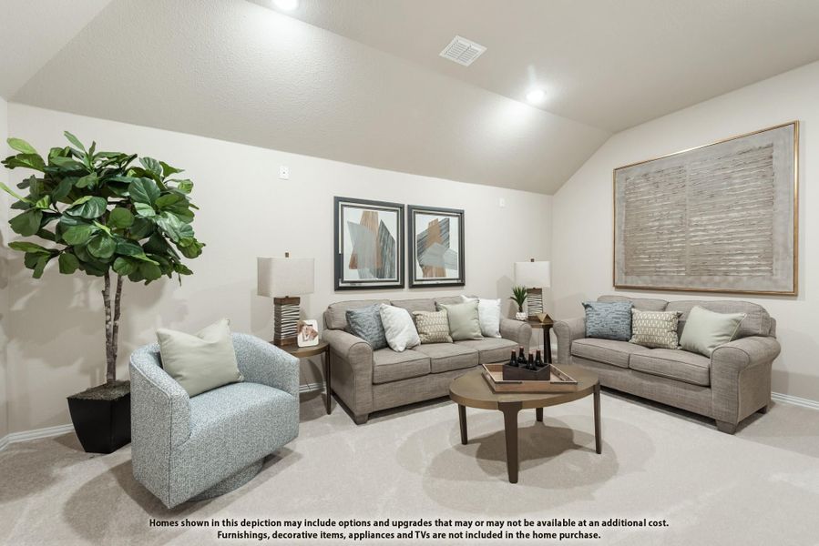 Living room with vaulted ceiling, gray sofas, round coffee table, and carpet flooring Living room with vaulted ceiling, gray sofas, round coffee table, and carpet flooring