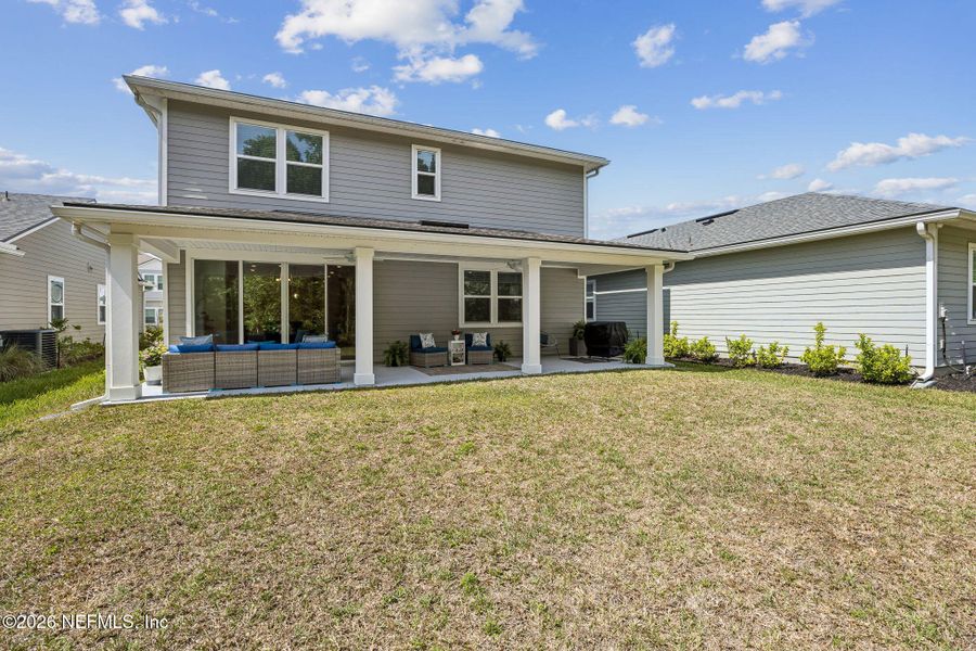 Exterior details and patio area of a home in Tributary, Yulee (Image 26).