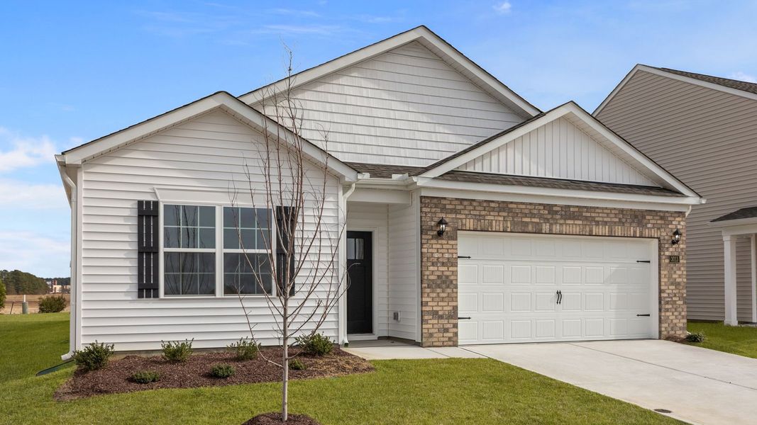 Front exterior of a new home in Ridgewood Farms, Winterville, NC, highlighting curb appeal (Image 17).