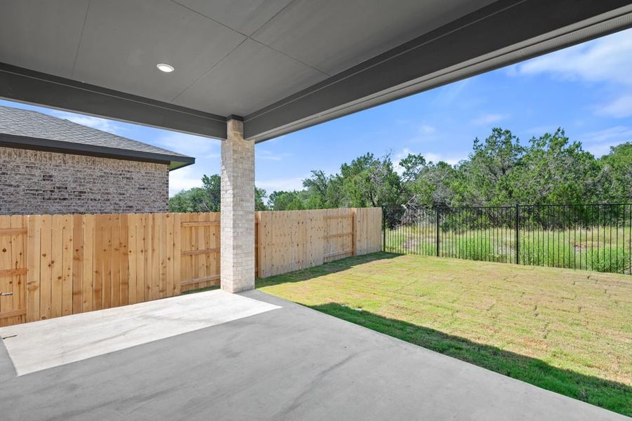 Exterior details and patio area of a home in Capitol Collection at Lariat, Liberty Hill (Image 28).