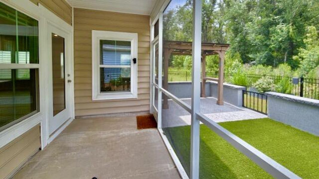 Exterior details and patio area of a home in Horizons at Summers Corner | 55+, Summerville (Image 21).