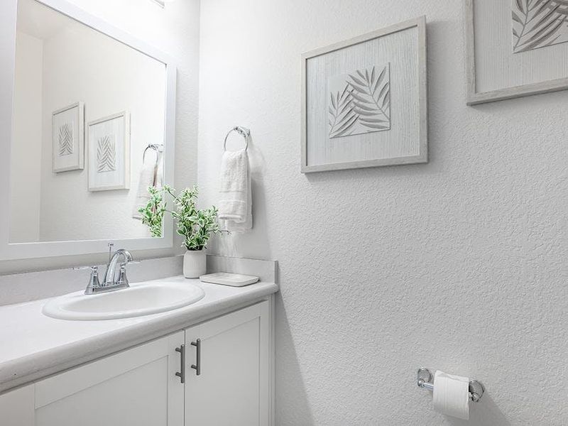 And, a convenient powder room serves guests - Shelby II by Highland Homes