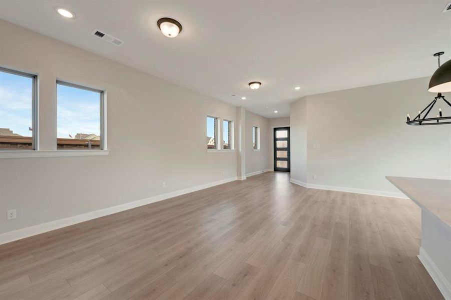 Spare room featuring recessed lighting and light wood-type flooring