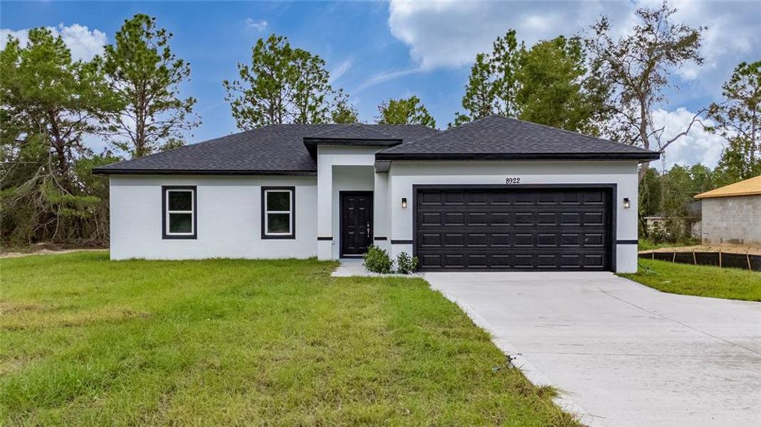 Front exterior of a new home in , Ocala, FL, highlighting curb appeal (Image 30).