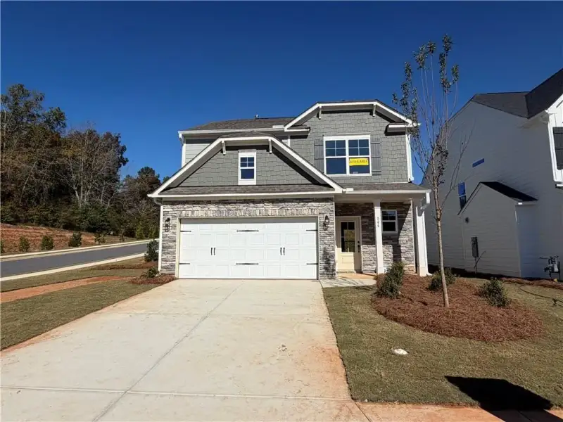 Front exterior of a new home in Villas at Dawsonville, Dawsonville, GA, highlighting curb appeal (Image 2). Front exterior of a new home in Villas at Dawsonville, Dawsonville, GA, highlighting curb appeal (Image 2).