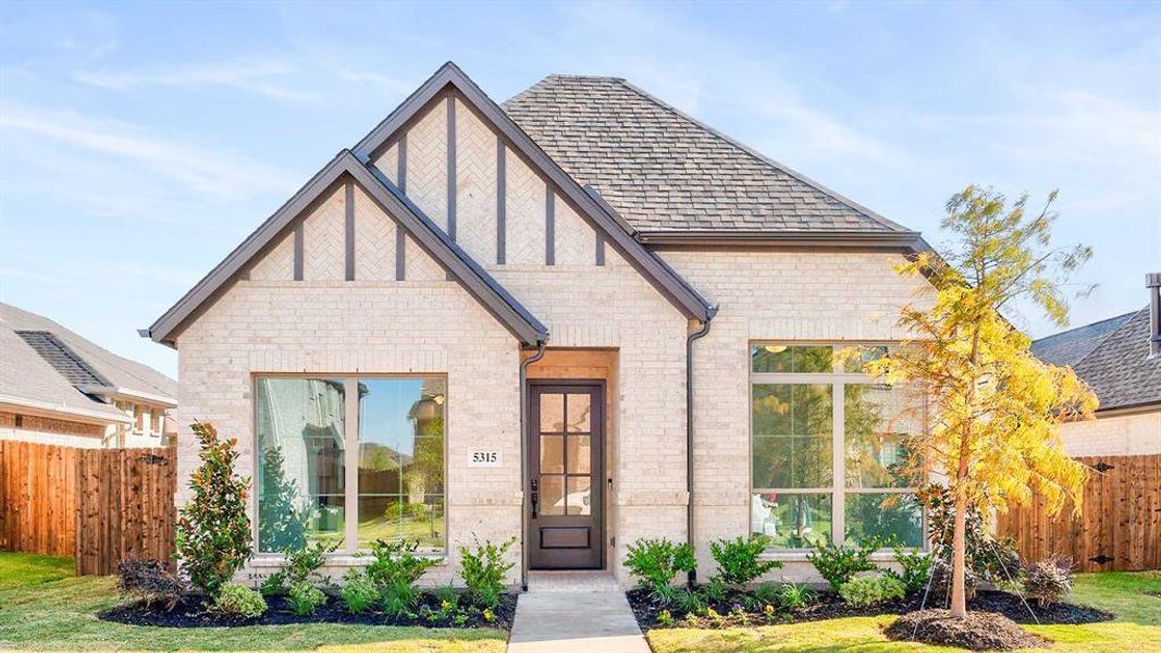 Front exterior of a new home in Avondale 40', Fate, TX, highlighting curb appeal (Image 1). Front exterior of a new home in Avondale 40', Fate, TX, highlighting curb appeal (Image 1).