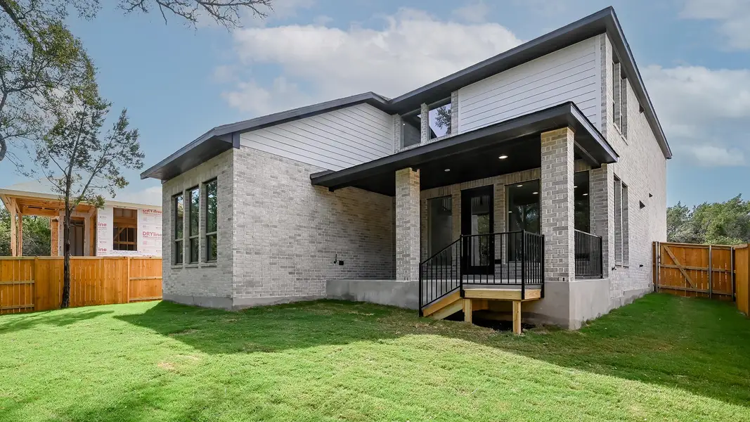 Front exterior of a new home in 6 Creeks 45', Kyle, TX, highlighting curb appeal (Image 2). Front exterior of a new home in 6 Creeks 45', Kyle, TX, highlighting curb appeal (Image 2).