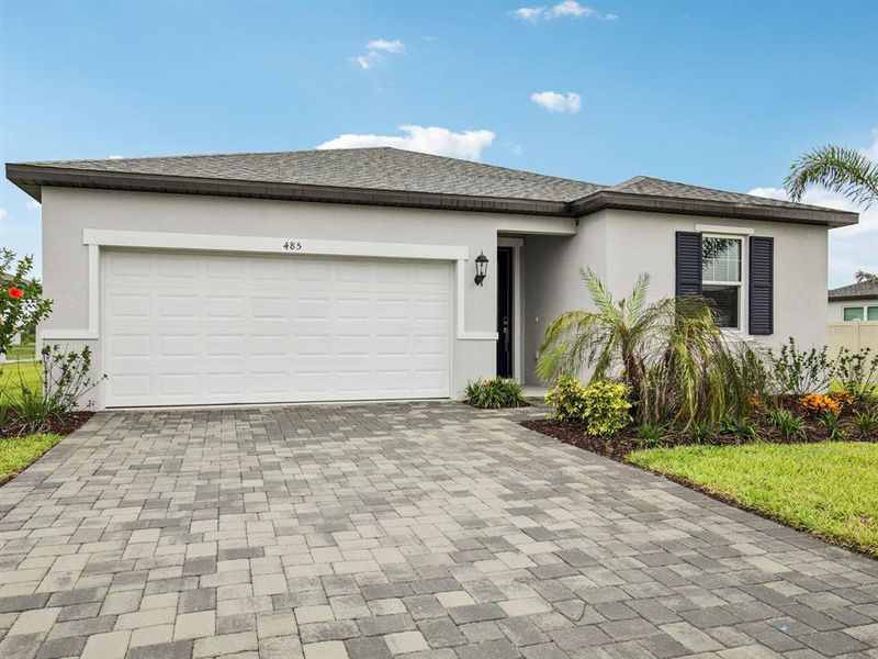 Front exterior of a home in the Magnolia Bay - Reserve Series community, located in Nokomis, FL (Image 16).